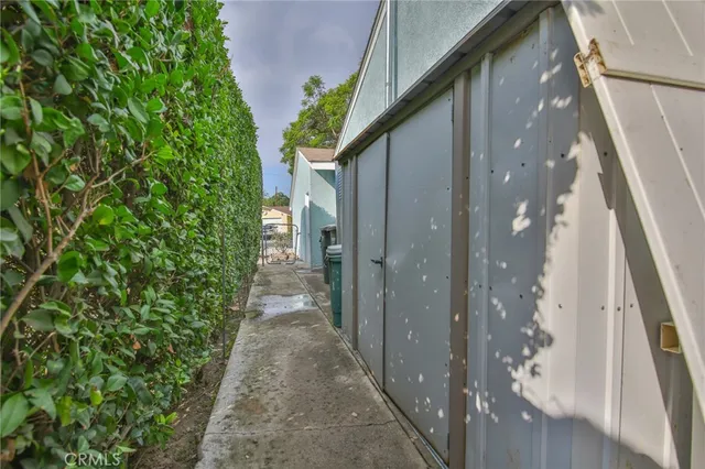 a porch with sliding door and wooden floor