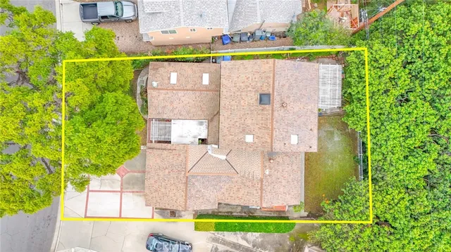 an aerial view of a house with a swimming pool