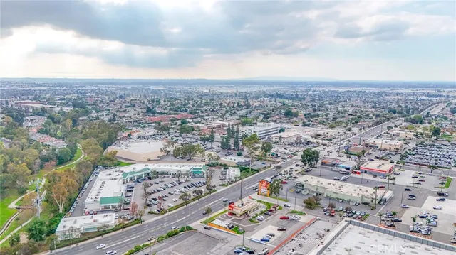 an aerial view of residential houses with city view