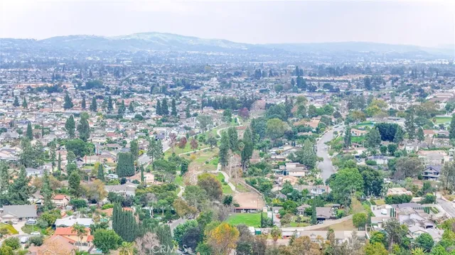 an aerial view of lake and residential houses with outdoor space