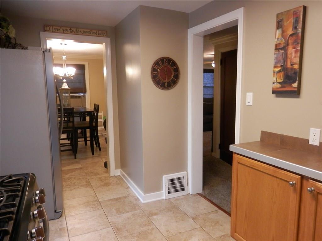 5575 Brownsville Road Pittsburgh, PA 15236 - Photo 11 of 25 View from the kitchen into the dining area and hallway.