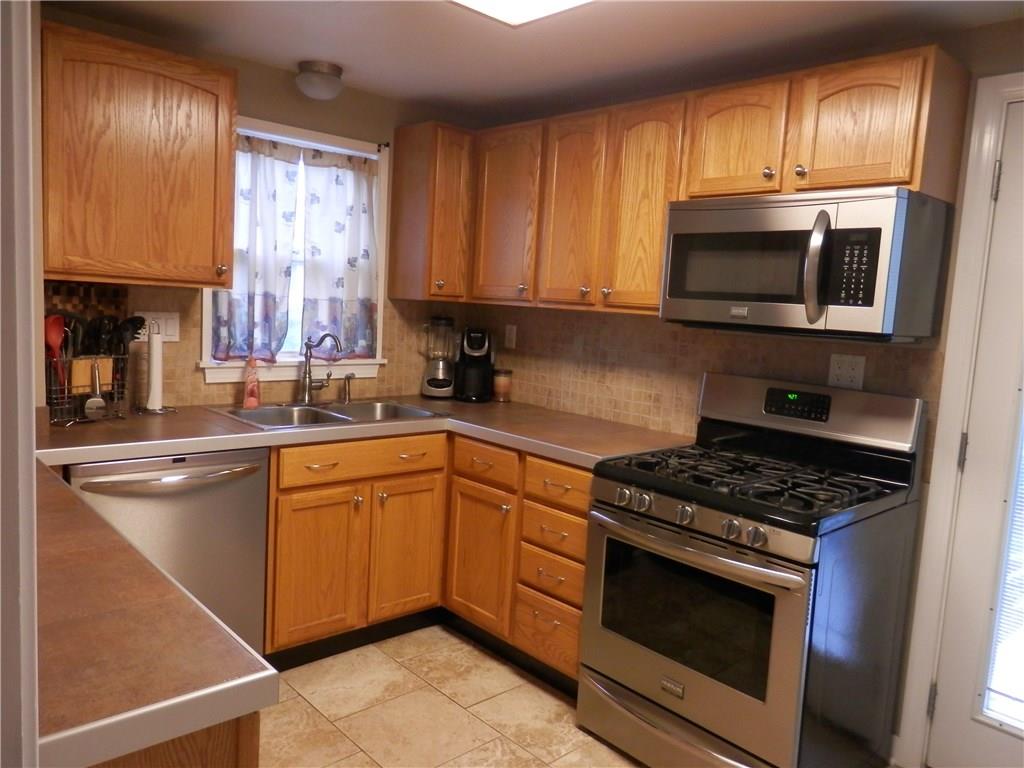5575 Brownsville Road Pittsburgh, PA 15236 - Photo 8 of 25 Beautiful stainless steel appliances in the updated kitchen.