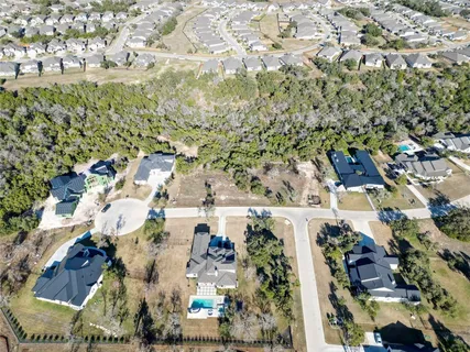 an aerial view of residential house with parking space and garden view