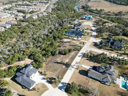 an aerial view of a residential houses with outdoor space