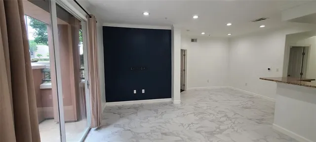 a view of an empty room with a bathroom