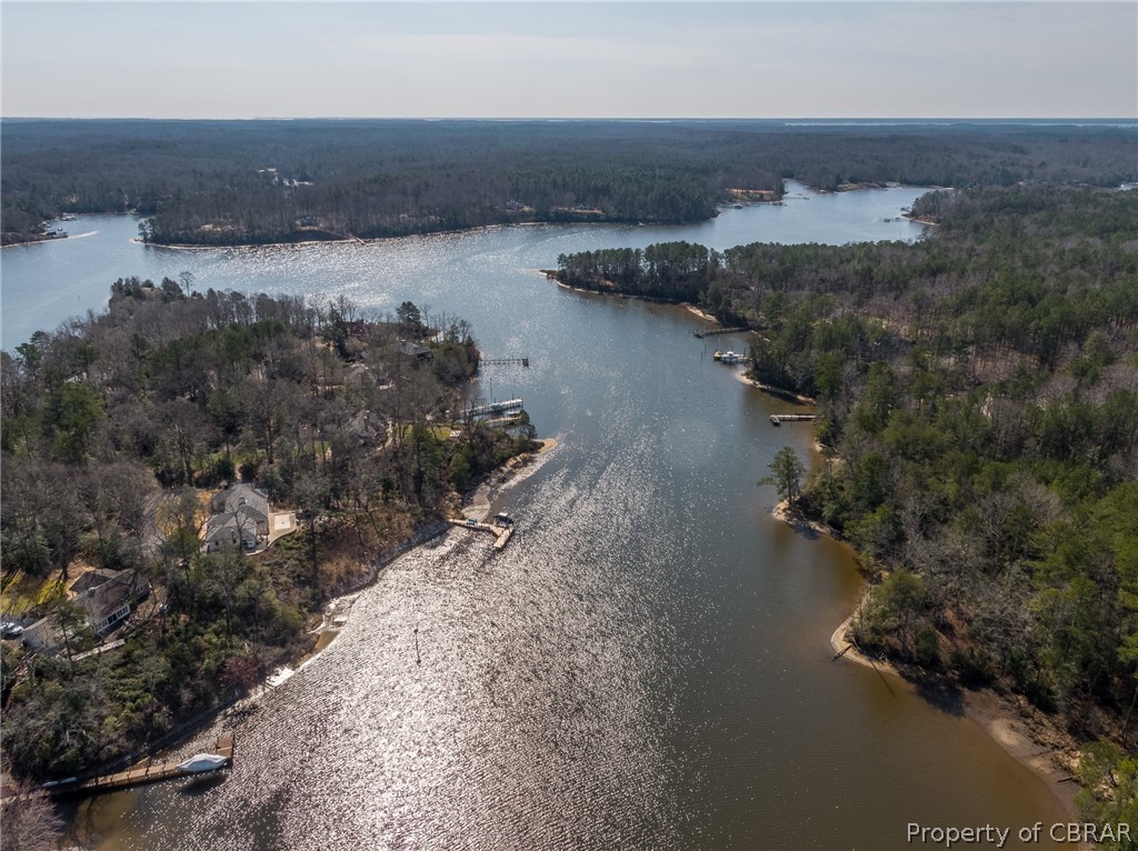 931 Laurel Point Road Lancaster, VA 22503 - Photo 16 of 21 an aerial view of house with yard and lake view