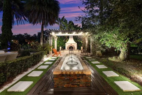 a outdoor space with couches and large trees