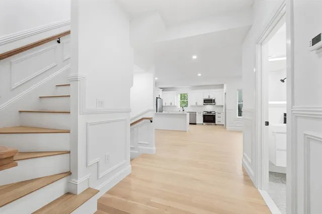 a view of kitchen with furniture and wooden floor
