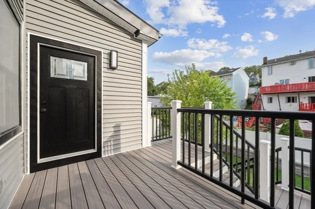 a view of a balcony with wooden floor