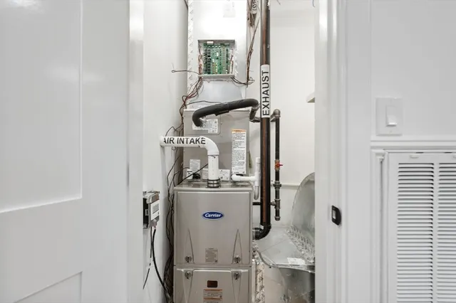 view of a room with water heater and cabinet