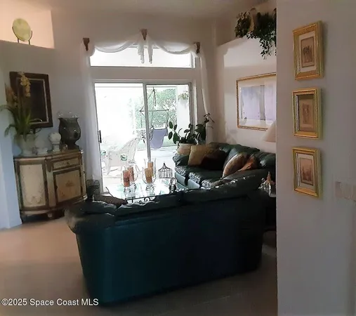 a living room with fireplace furniture and a flat screen tv