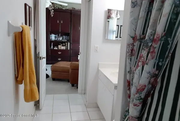 a hallway with a furniture and a walk in closet