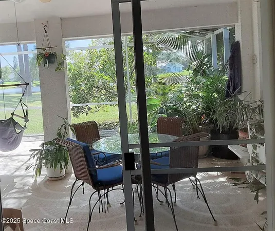 a house that has a big yard with large trees