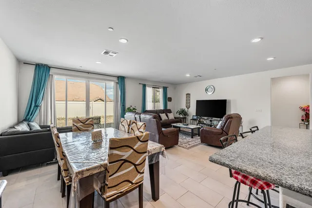 a living room with fireplace furniture and a flat screen tv