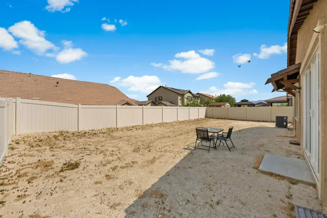 a view of backyard of the house