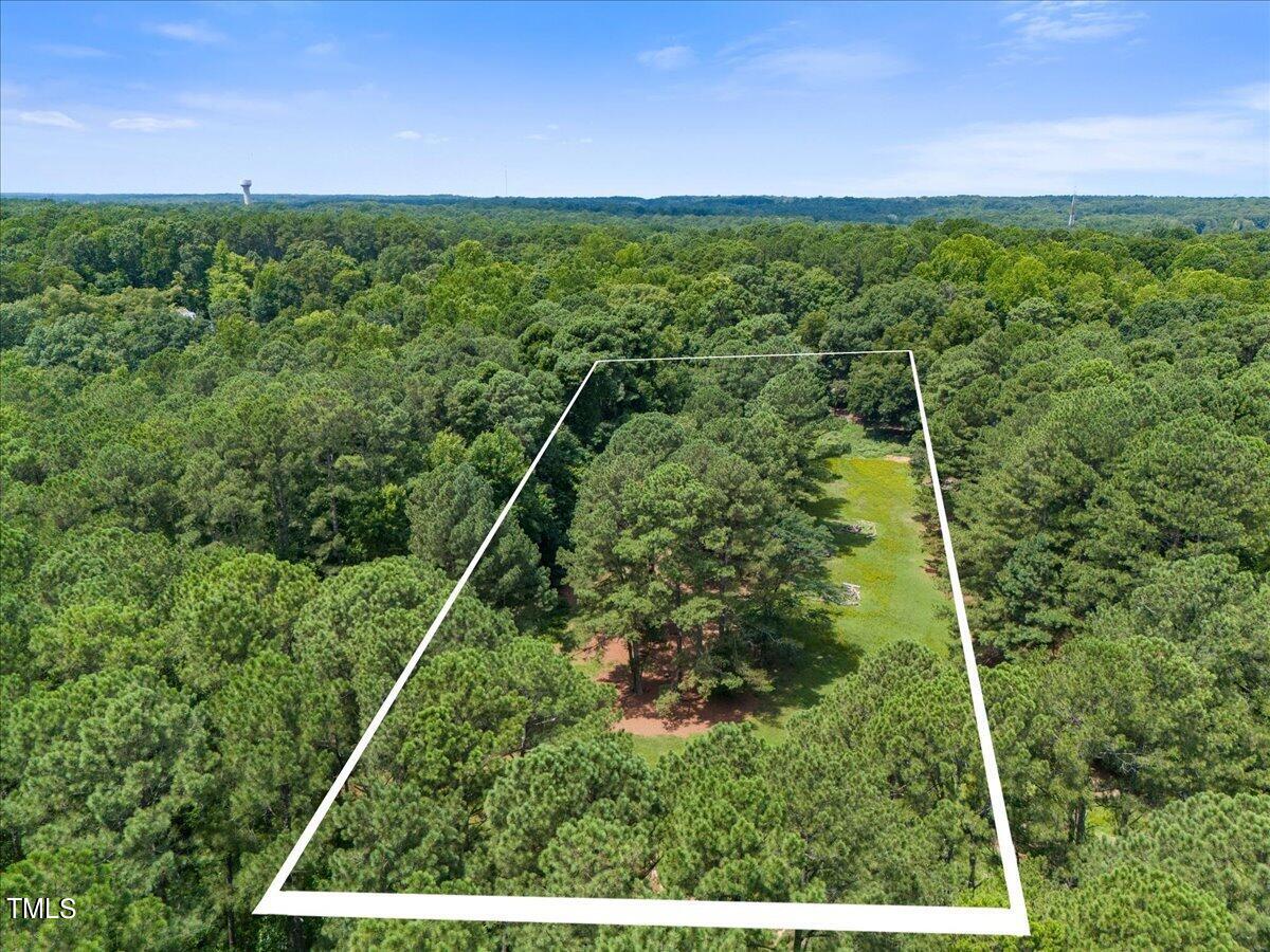 12932 Ghoston Road Wake Forest, NC 27587 - Photo 2 of 22 a view of a lush green field