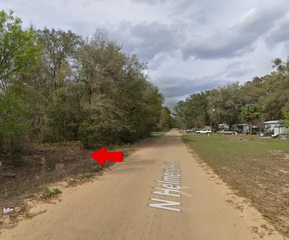 a view of street with an ocean view