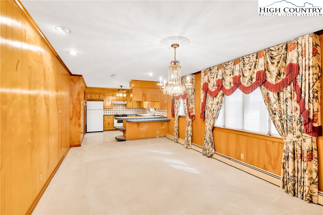 354 Old Wilkes Road Jefferson, NC 28640 - Photo 17 of 50 a view of an empty room with window furniture and front door
