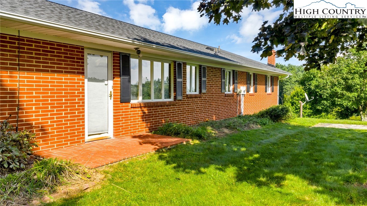 354 Old Wilkes Road Jefferson, NC 28640 - Photo 25 of 50 a view of front of a house with a yard