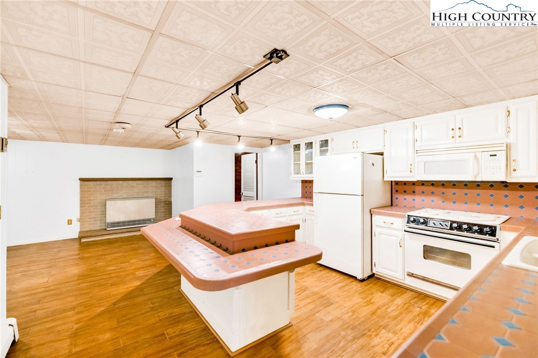 354 Old Wilkes Road Jefferson, NC 28640 - Photo 34 of 50 a view of kitchen with furniture and wooden floor