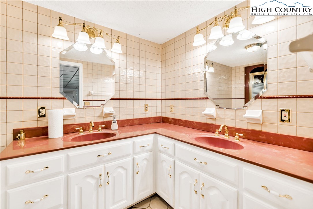 354 Old Wilkes Road Jefferson, NC 28640 - Photo 39 of 50 a kitchen with stainless steel appliances a sink and cabinets