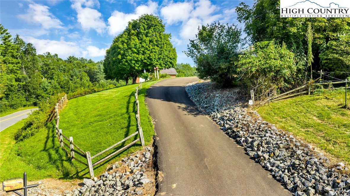 354 Old Wilkes Road Jefferson, NC 28640 - Photo 4 of 50 a view of a backyard with wooden fence