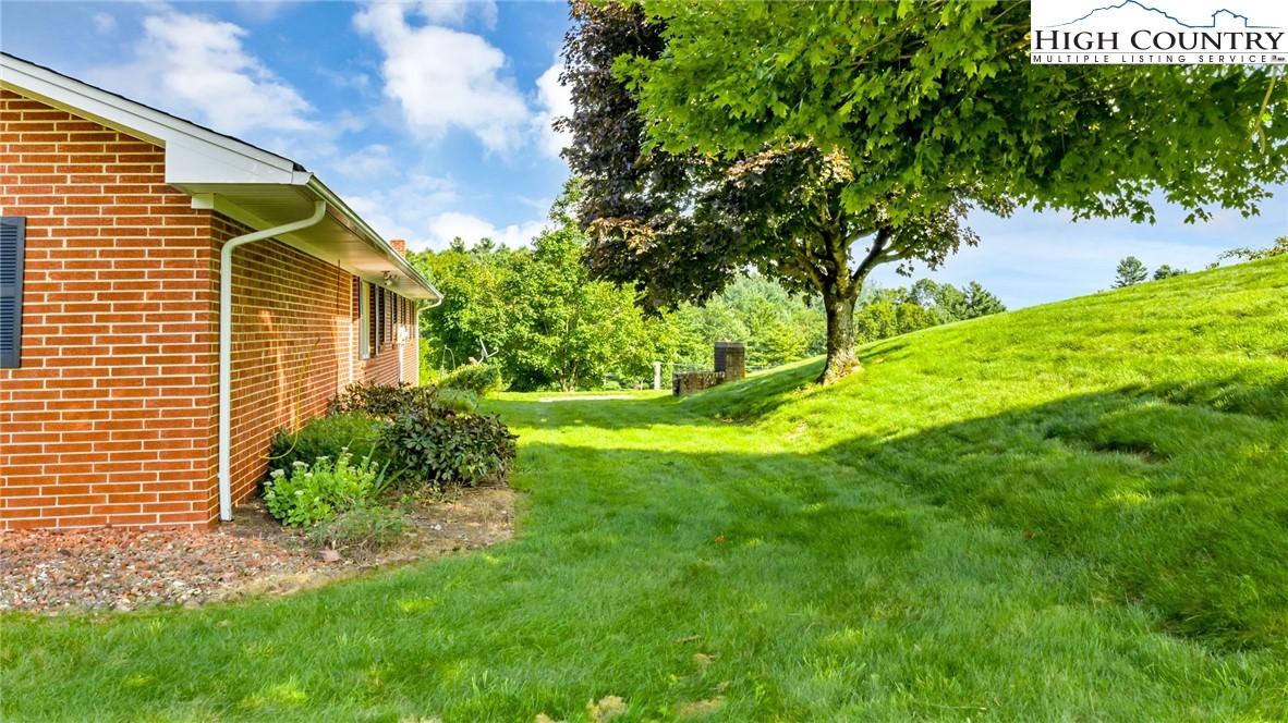 354 Old Wilkes Road Jefferson, NC 28640 - Photo 48 of 50 a backyard of a house with lots of green space