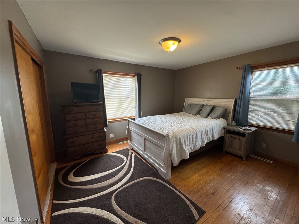 3828 Lake Road West Ashtabula, OH 44004 - Photo 11 of 29 Bedroom with hardwood floors and a double closet
