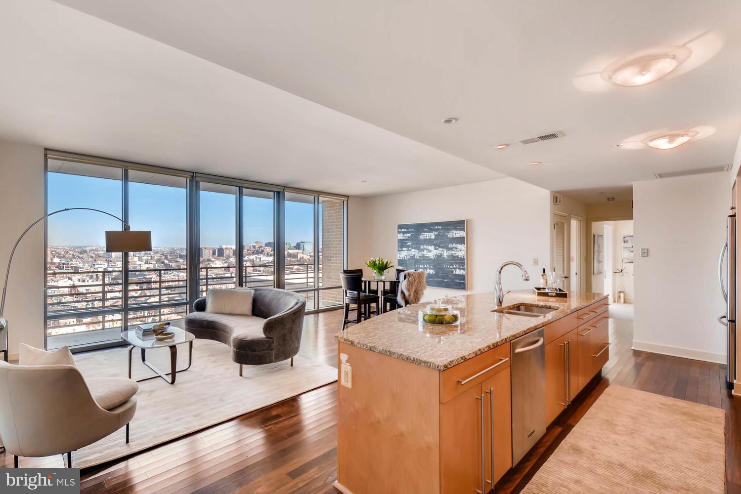 a view of a kitchen with a large window