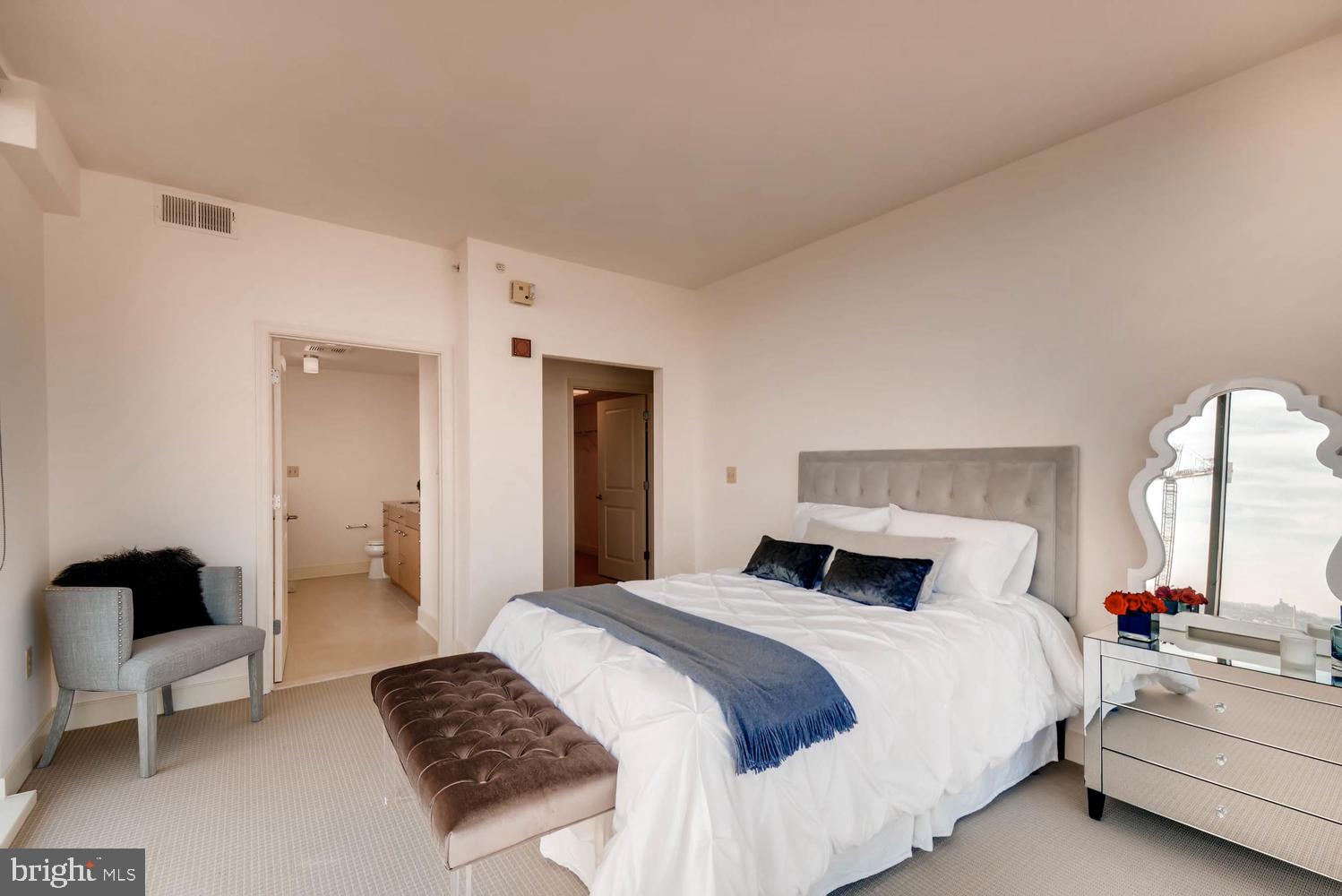 675 President Street, Unit 1806 Baltimore, MD 21202 - Photo 14 of 46 a bedroom with a bed and a couch