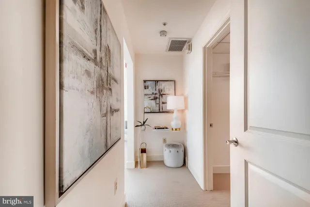 a view of a hallway with shelves