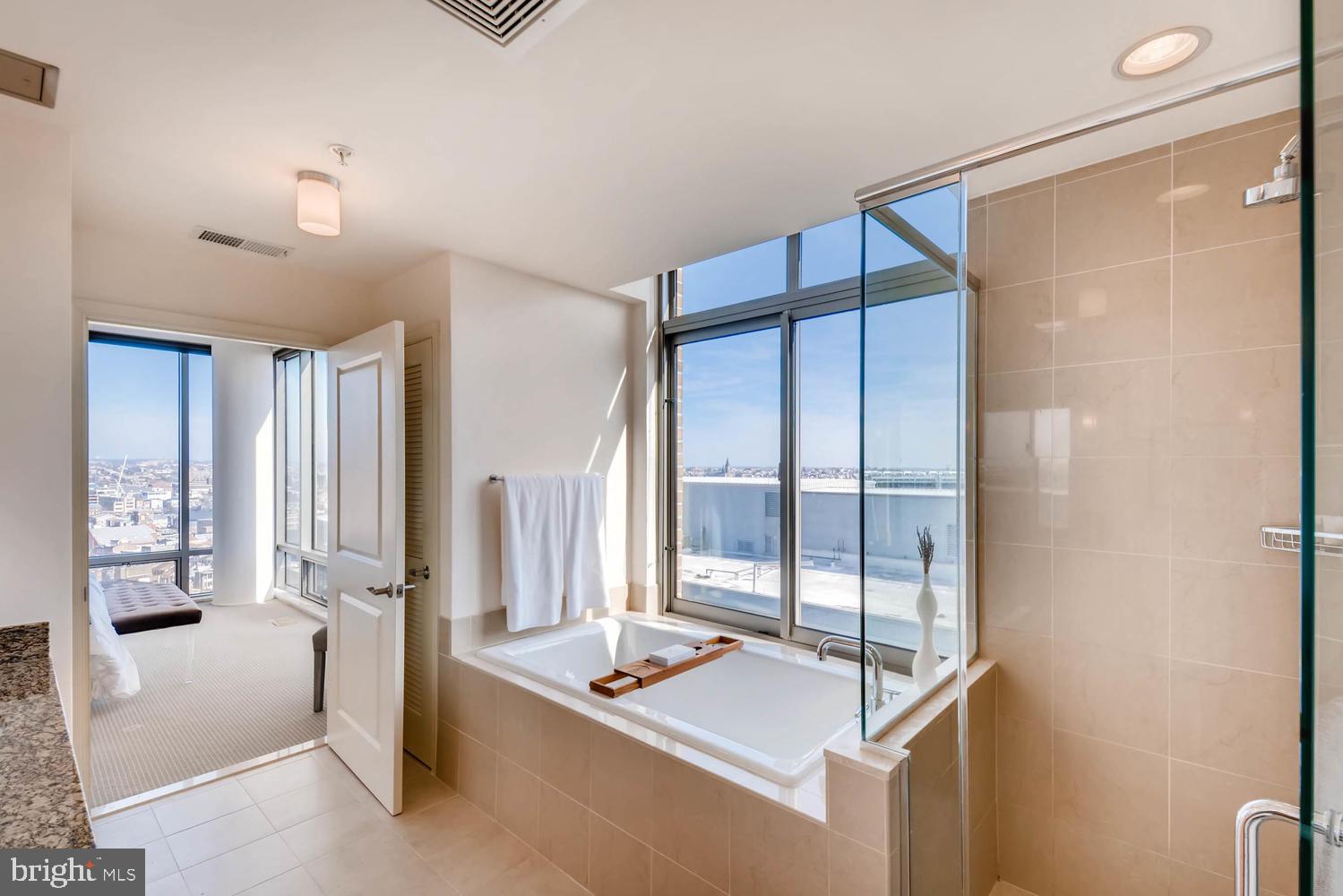 675 President Street, Unit 1806 Baltimore, MD 21202 - Photo 19 of 46 a bedroom with furniture and window