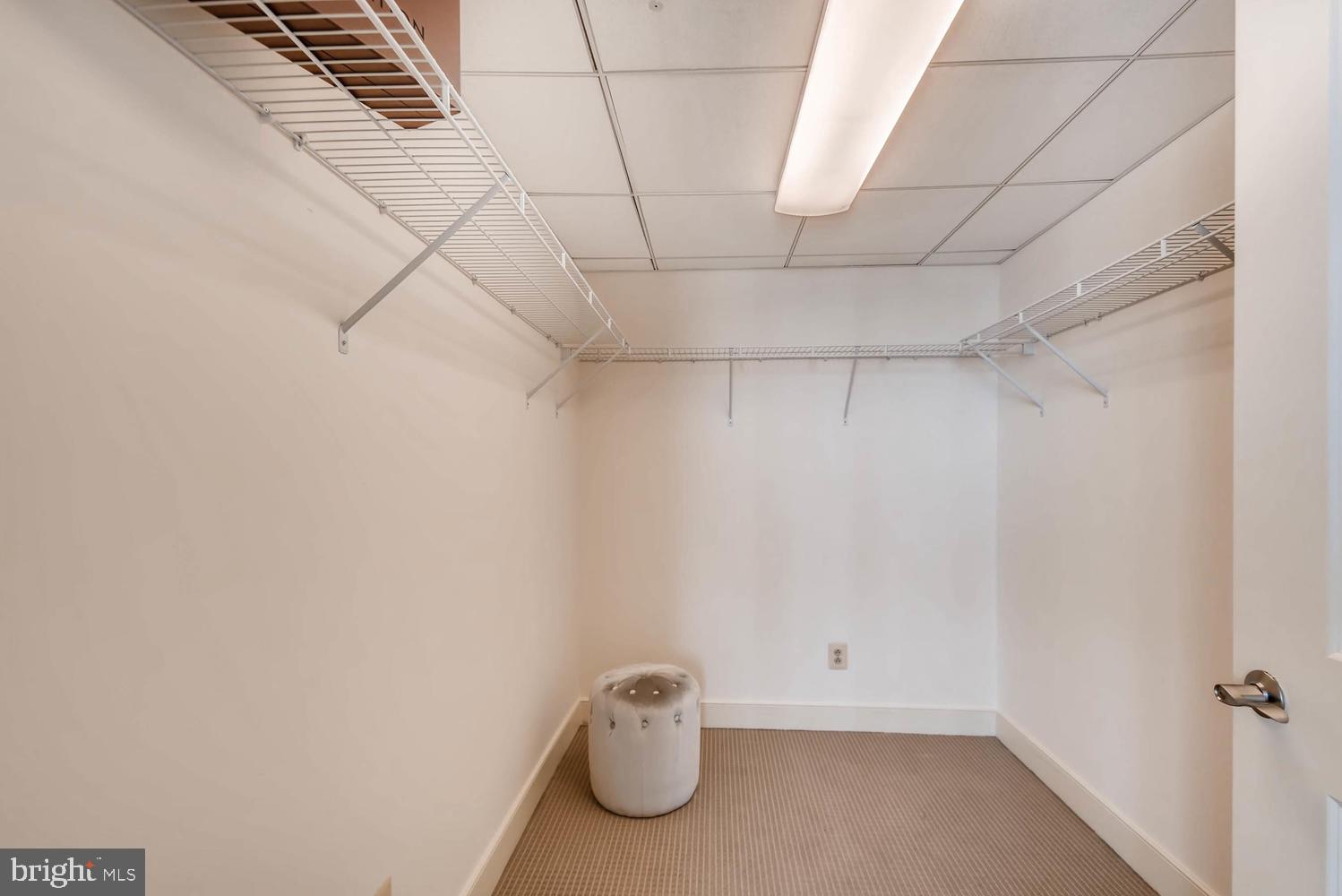 675 President Street, Unit 1806 Baltimore, MD 21202 - Photo 22 of 46 a view of room with racks on the wall