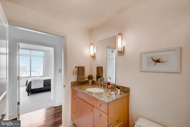 a en suite bathroom with a sink and a mirror