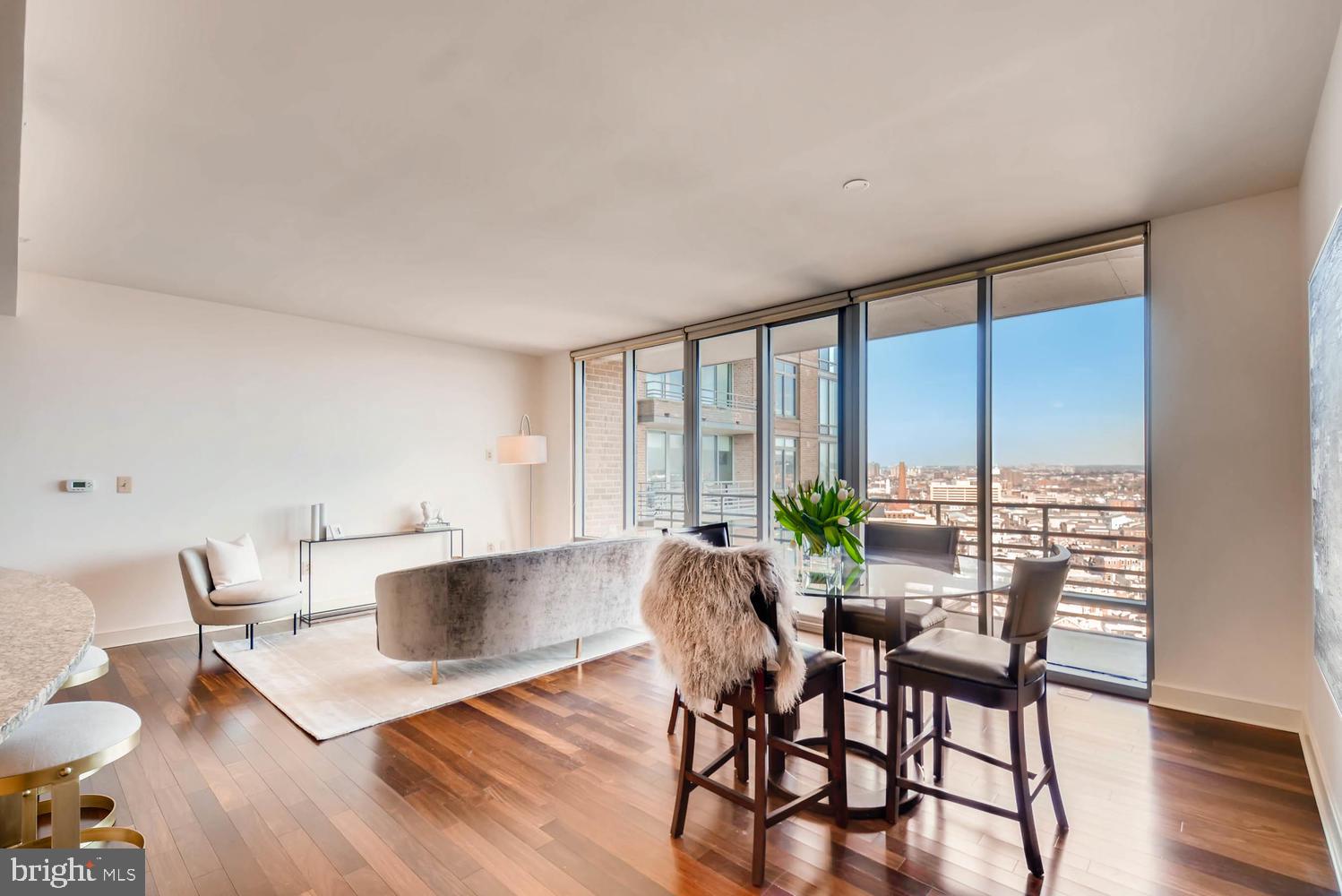 675 President Street, Unit 1806 Baltimore, MD 21202 - Photo 3 of 46 a view of a dining room with furniture and wooden floor