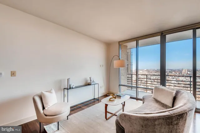 a living room with furniture and a large window