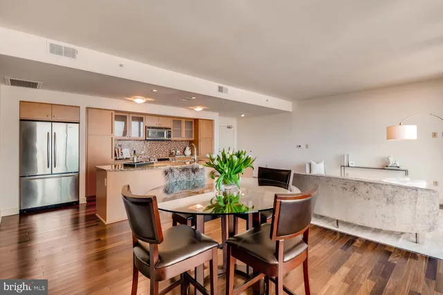 a view of a dining room with furniture and wooden floor