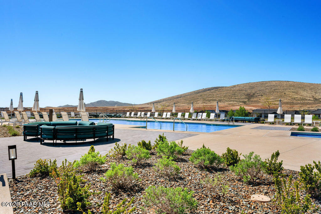 5994 East Killen Loop Prescott Valley, AZ 86314 - Photo 107 of 119 a view of swimming pool with outdoor seating and a garden