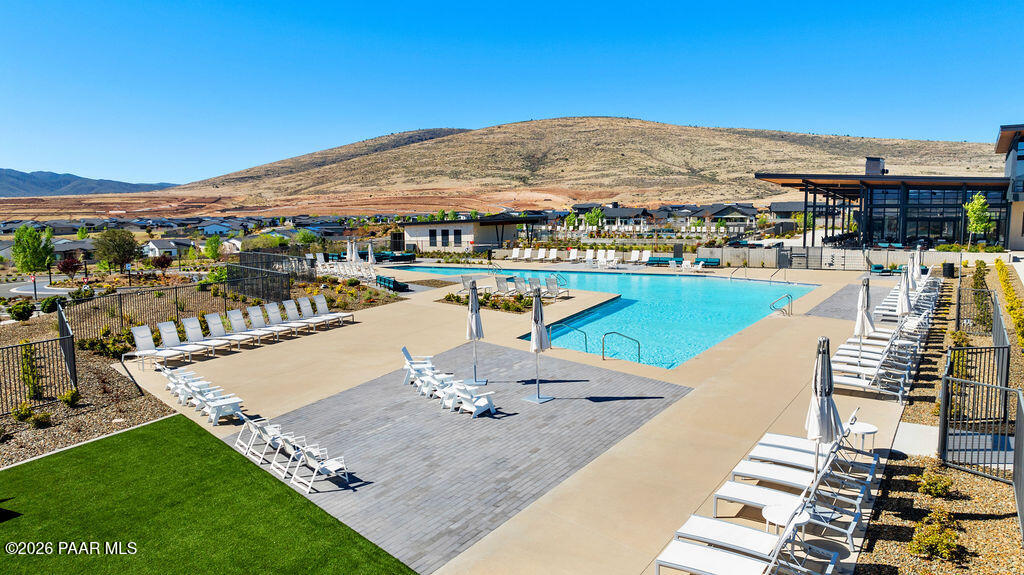 5994 East Killen Loop Prescott Valley, AZ 86314 - Photo 113 of 119 a view of a swimming pool with lounge chairs