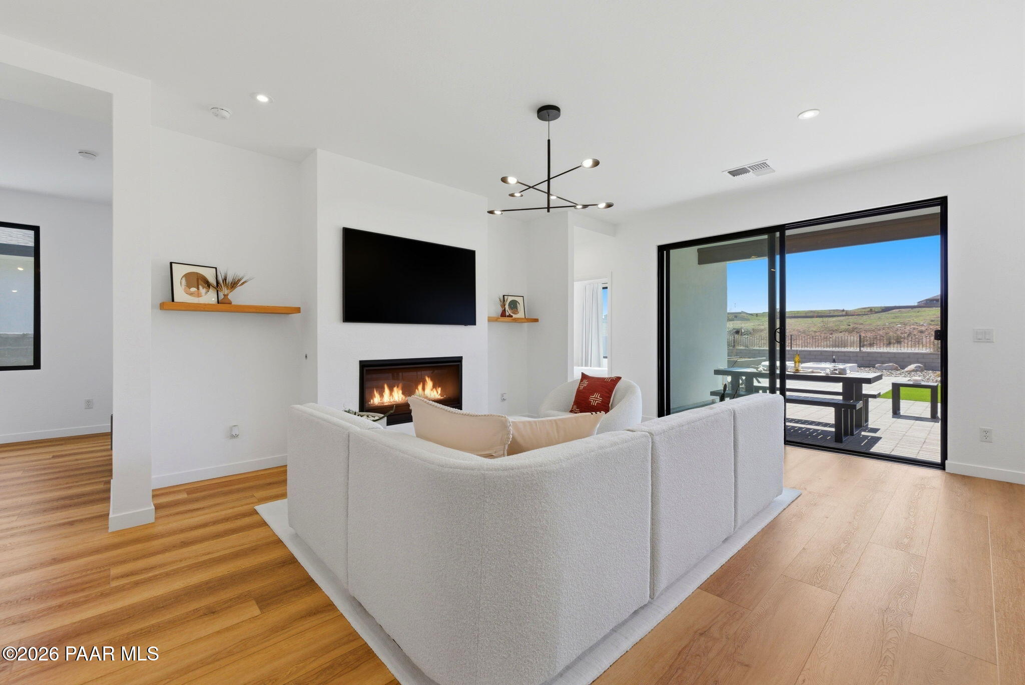 5994 East Killen Loop Prescott Valley, AZ 86314 - Photo 5 of 119 a living room with fireplace furniture and a flat screen tv