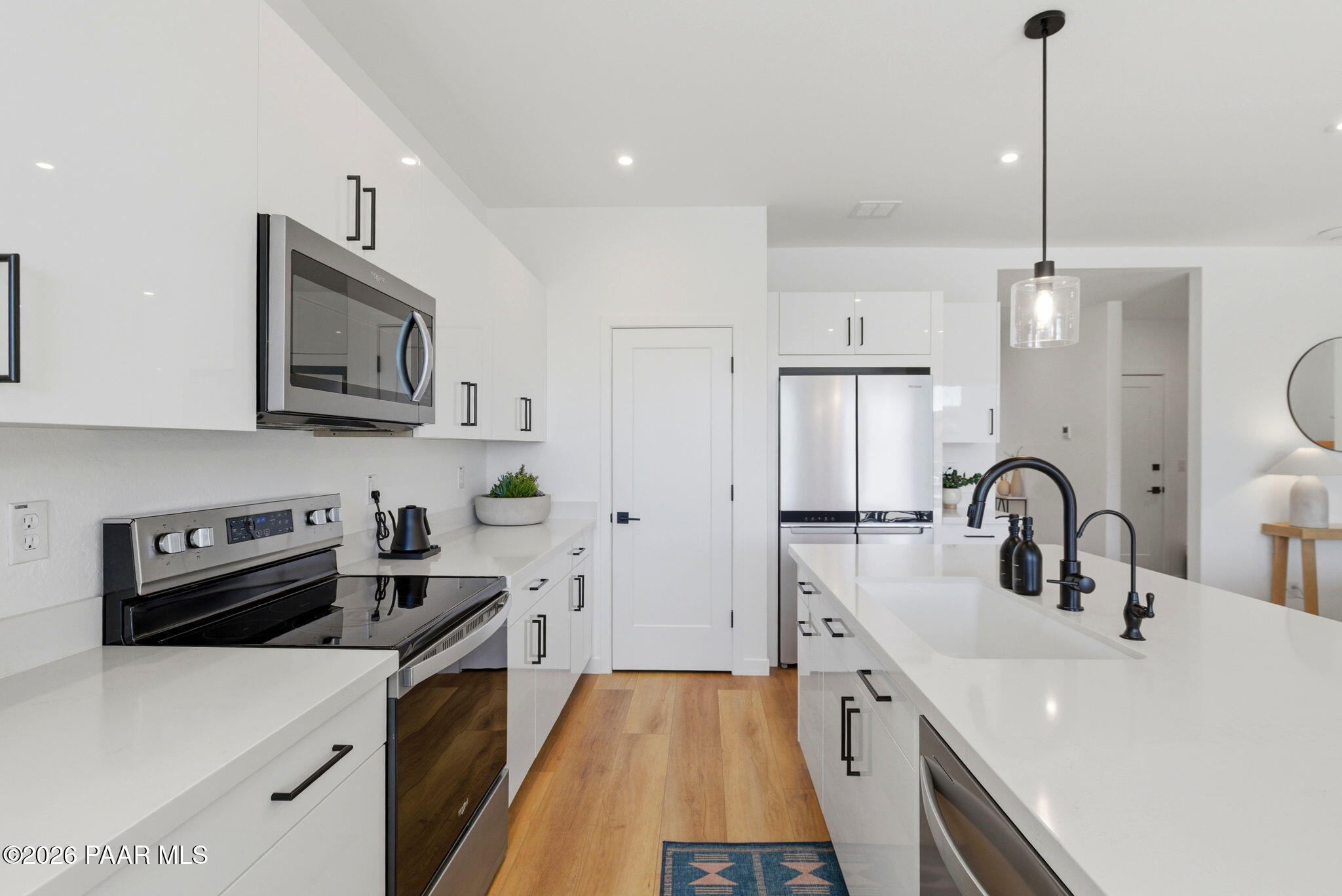 5994 East Killen Loop Prescott Valley, AZ 86314 - Photo 9 of 119 a kitchen with stainless steel appliances a sink stove and refrigerator