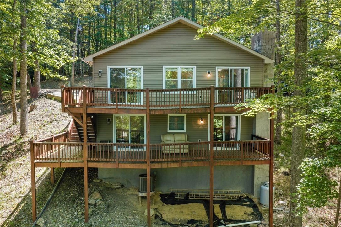 467 Horseshoe Ridge Road East Deep Gap, NC 28618 - Photo 3 of 46 a view of a house with backyard