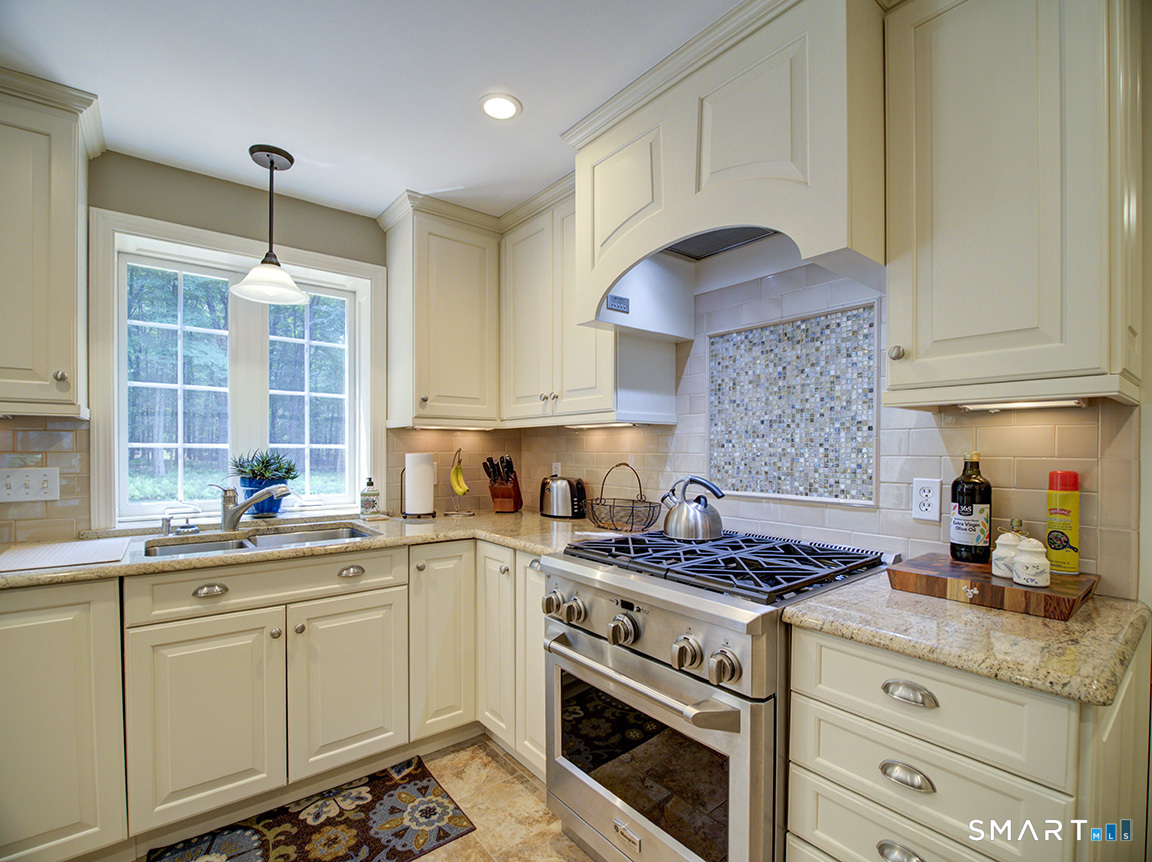 19 East Ridge Court Cheshire, CT 06410 - Photo 10 of 39 Propane range and vented hood.
