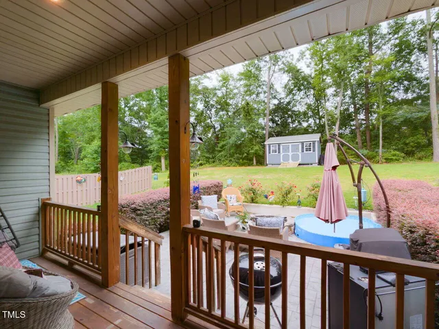a view of a two chairs in the balcony