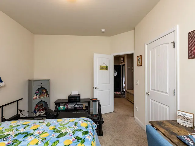 a bedroom with furniture and a window