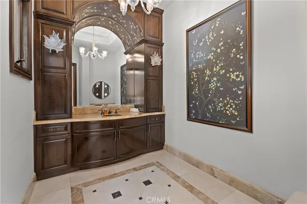 a bathroom with a sink a mirror and a shower
