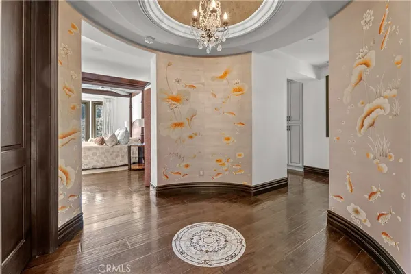 a view of an entryway with wooden floor