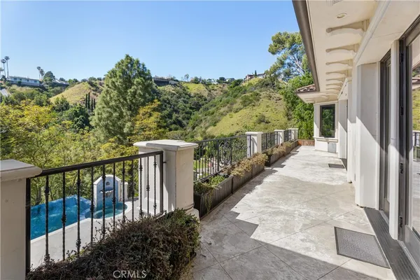 a view of a balcony with an outdoor space