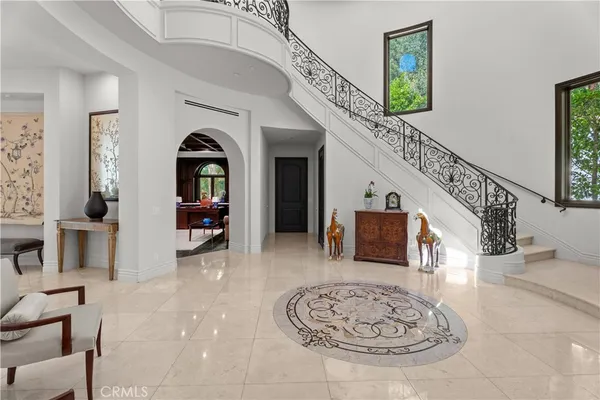 a view of entryway and hall with a front door