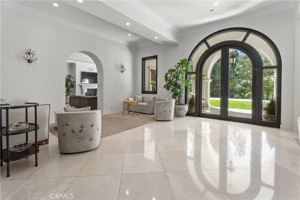 a view of a living room and entryway